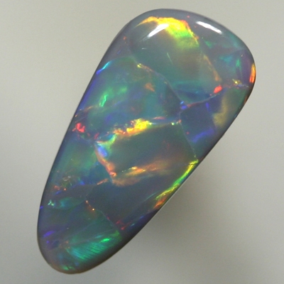 SOLID BLACK OPAL Large rolling flashes, red to gold to green